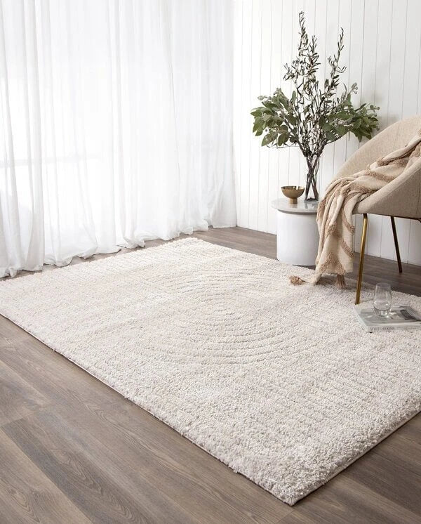 New arrival rug in a living room with decors.